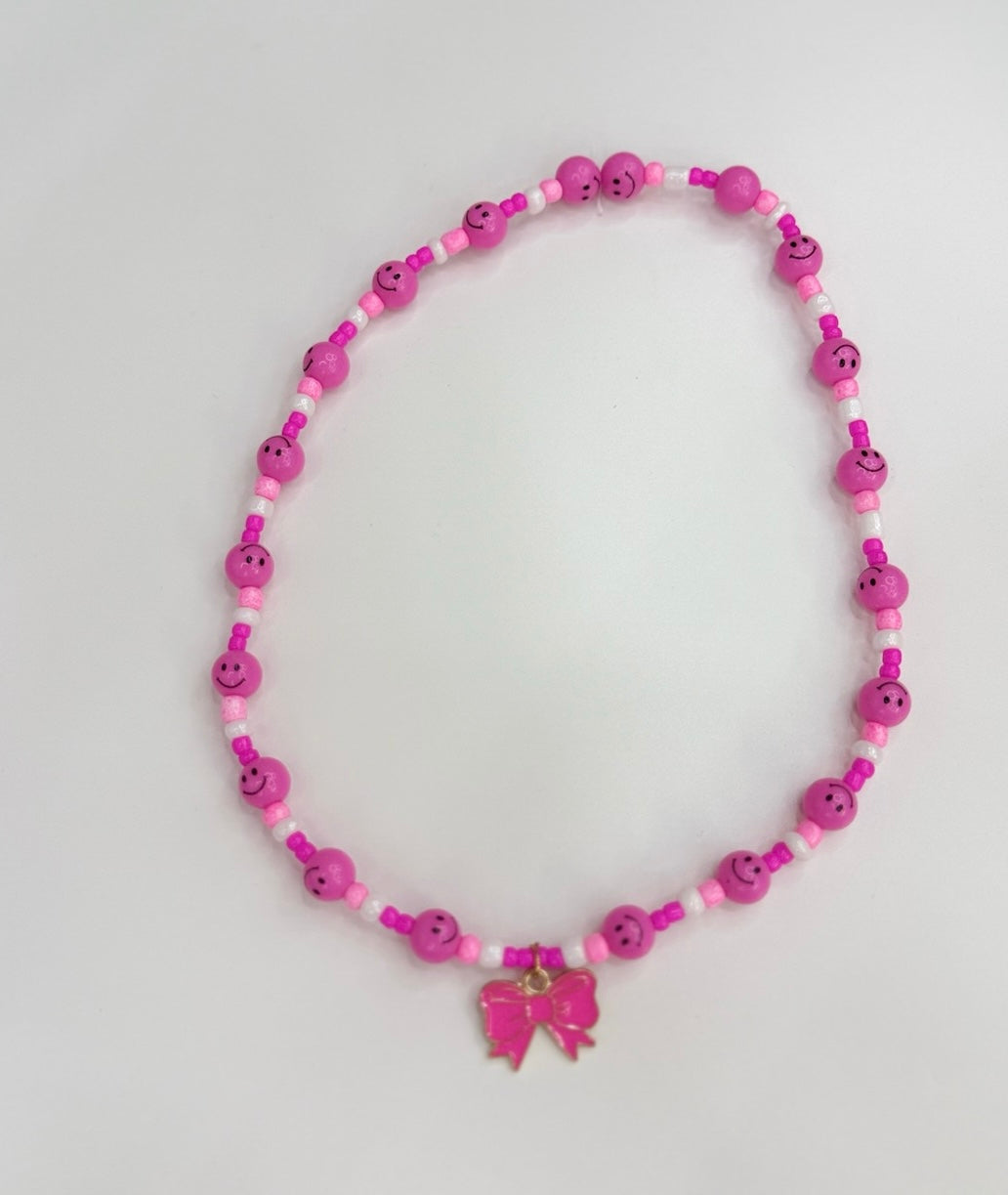 Hot pink smilies & bow charm toddler necklace